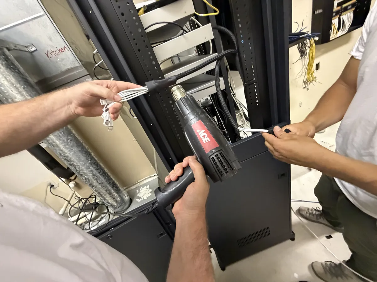 Firebird AV crew building the new 42U equipment rack during the estate takeover